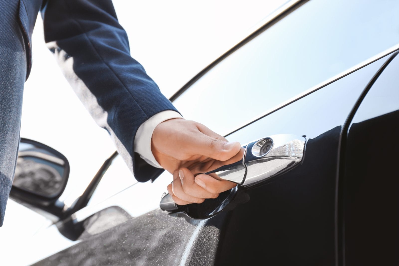 Chauffeur at the car door for a Brookfield to Midway transfer