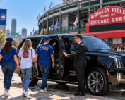 Milwaukee to Wrigley Field limo service with a black luxury SUV and professional chauffeur bringing Wisconsin Cubs fans to Chicago for game day.